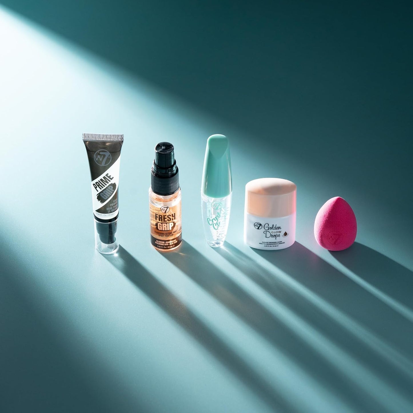 W7 On the Go Essentials Gift Set - Mini Makeup Must-Haves with Primer, Setting Spray, Mascara, Golden Glow Bronzing Drops & Beauty Sponge - Travel or Handbag Size Essentials